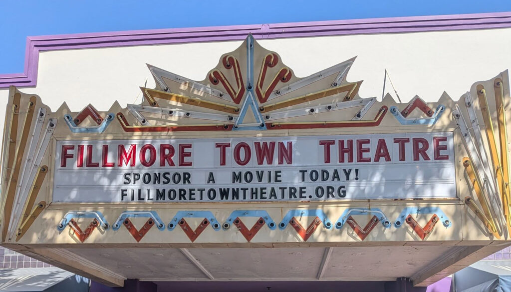 Historic Fillmore Town Theatre marquee displaying the message “Sponsor a Movie Today!” and the website FillmoreTownTheatre.org.